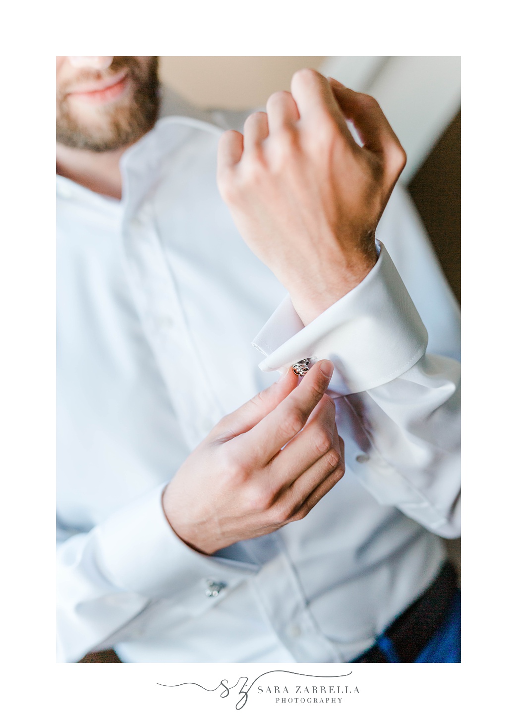 groom adjusts cufflinks before NJ wedding