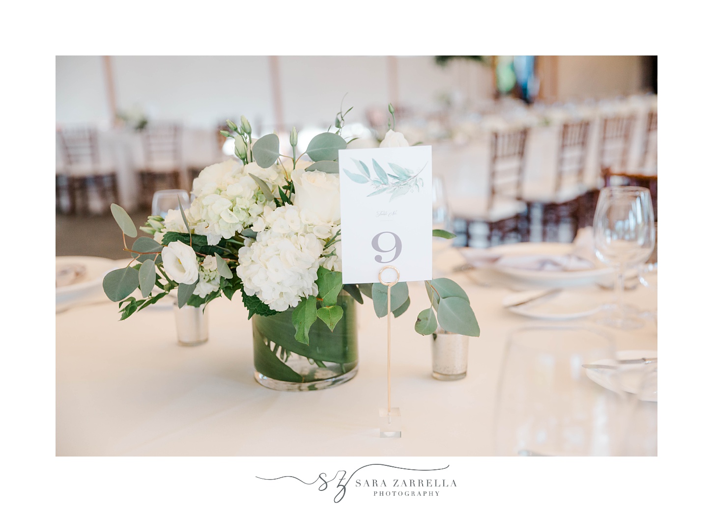 table numbers and white flowers at Castle Hill Inn
