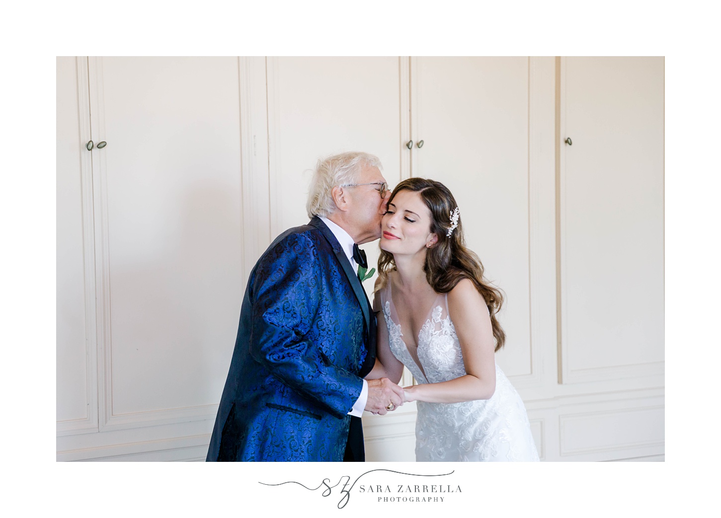 dad kisses bride's cheek after first look