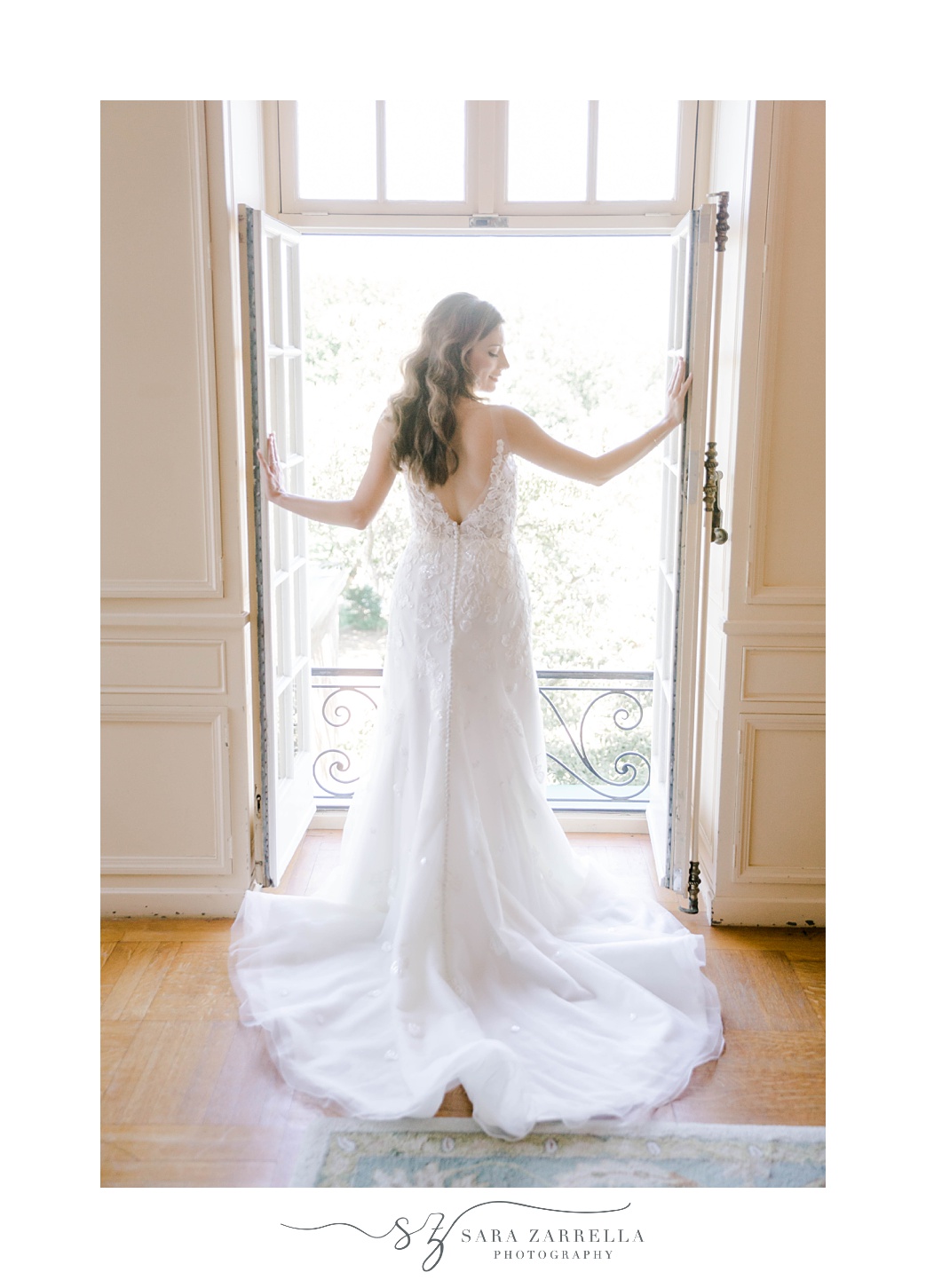 bride poses in window at Glen Manor House