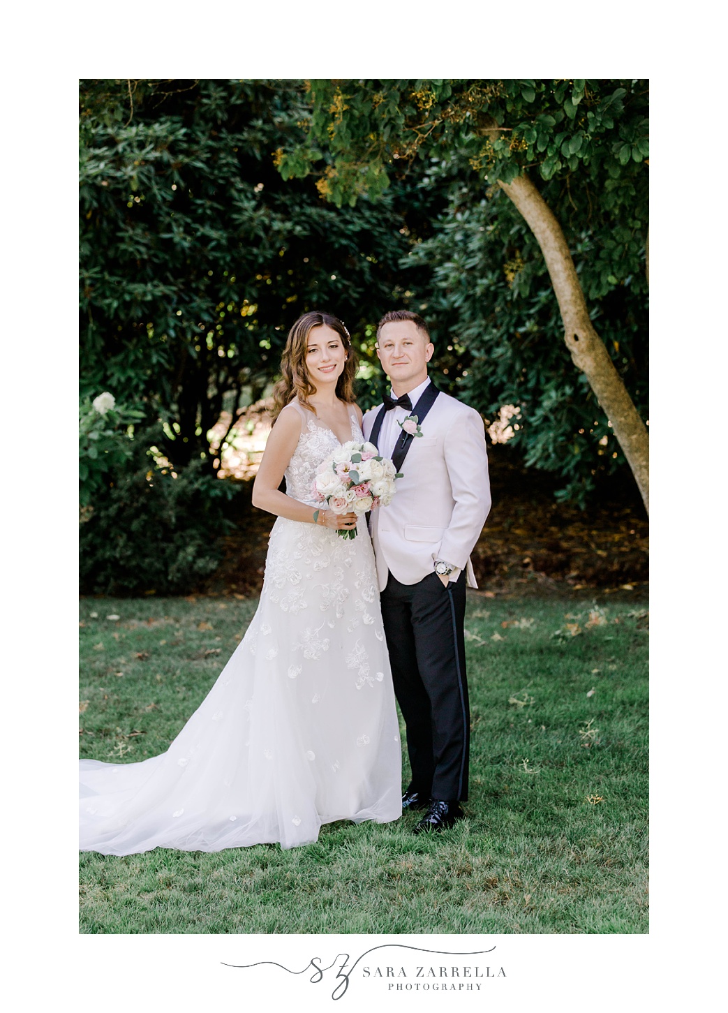 bride and groom stand together on lawn at Glen Manor House
