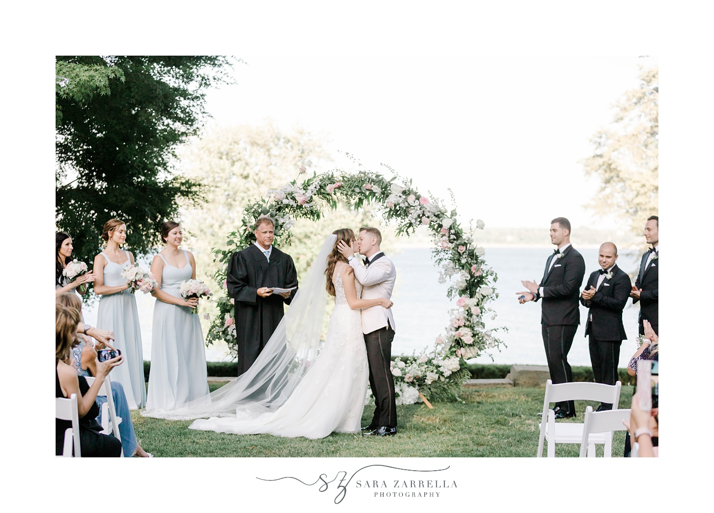 couple kisses after wedding ceremony on lawn at Glen Manor House