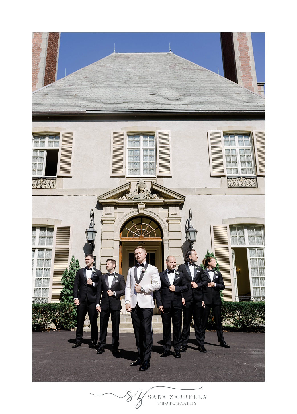 groom and groomsmen stand outside Glen Manor House