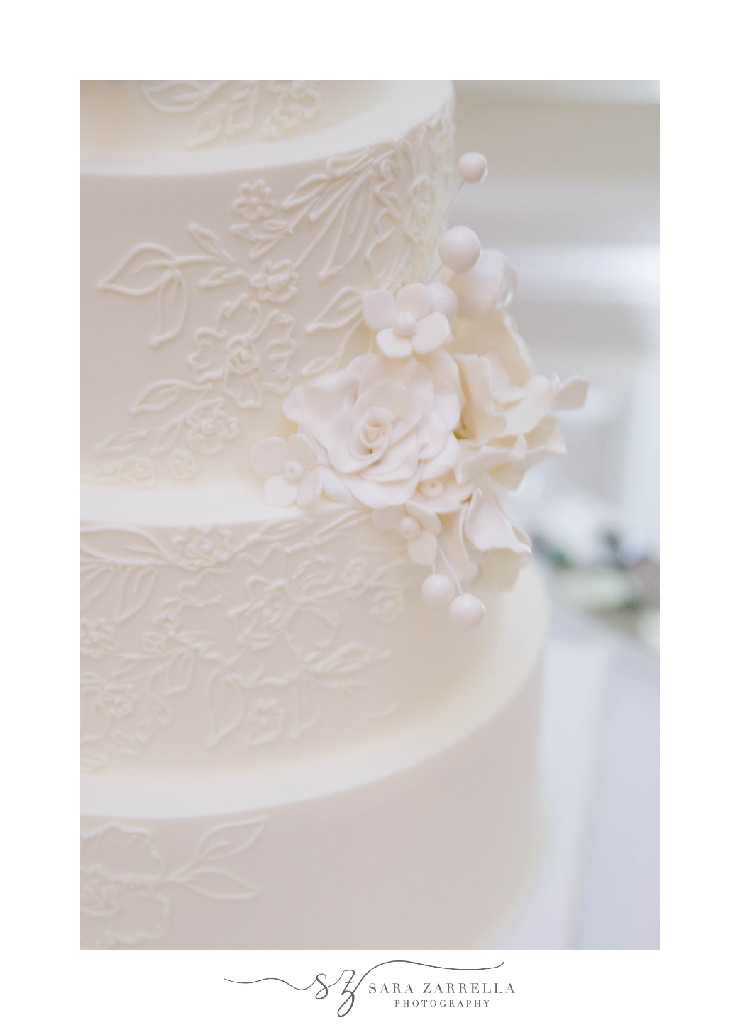 white wedding cake with icing details 