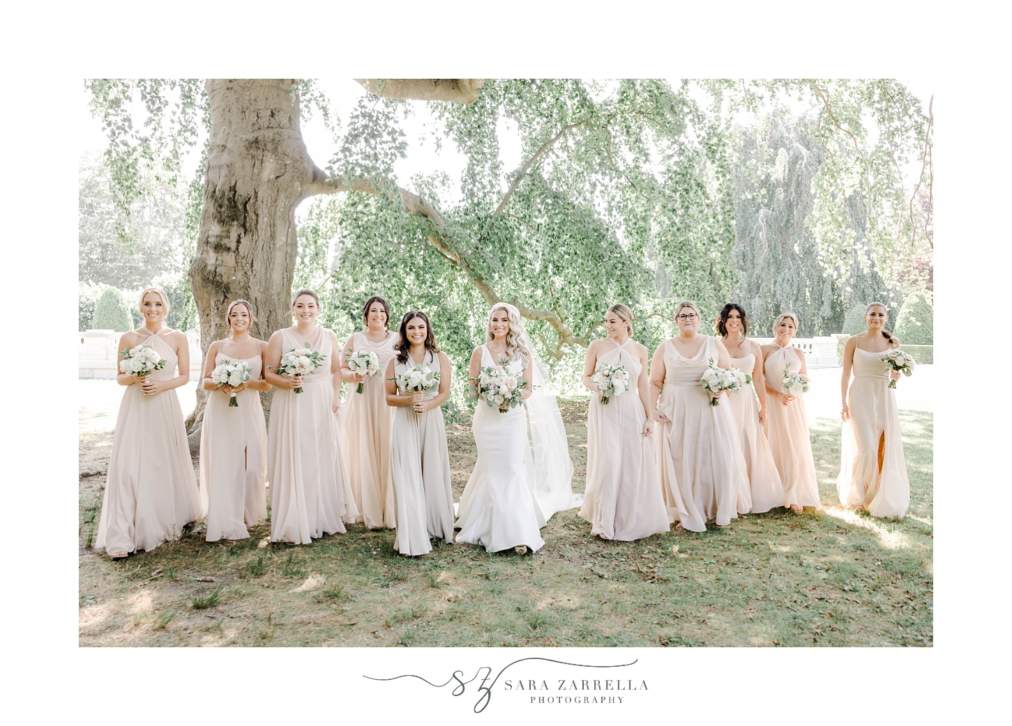 bride walks with bridesmaids at The Elms