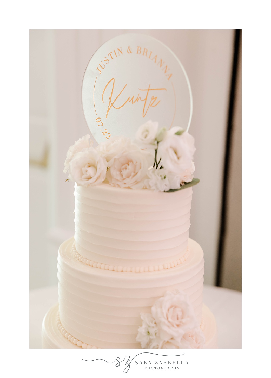 tiered wedding cake with custom cake topper