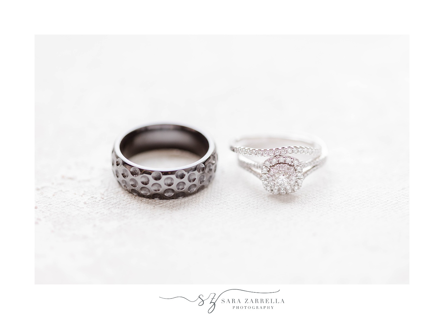 bride and groom's wedding bands on ivory backdrop 