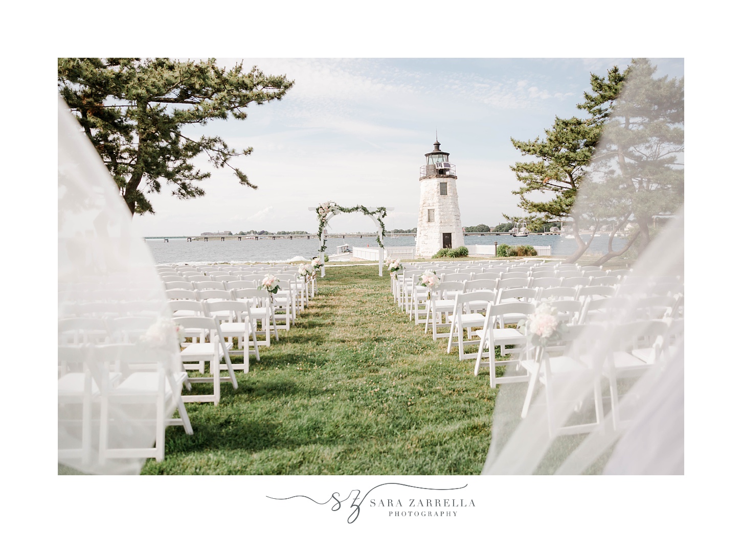 Gurney’s Newport wedding ceremony on lawn by lighthouse 