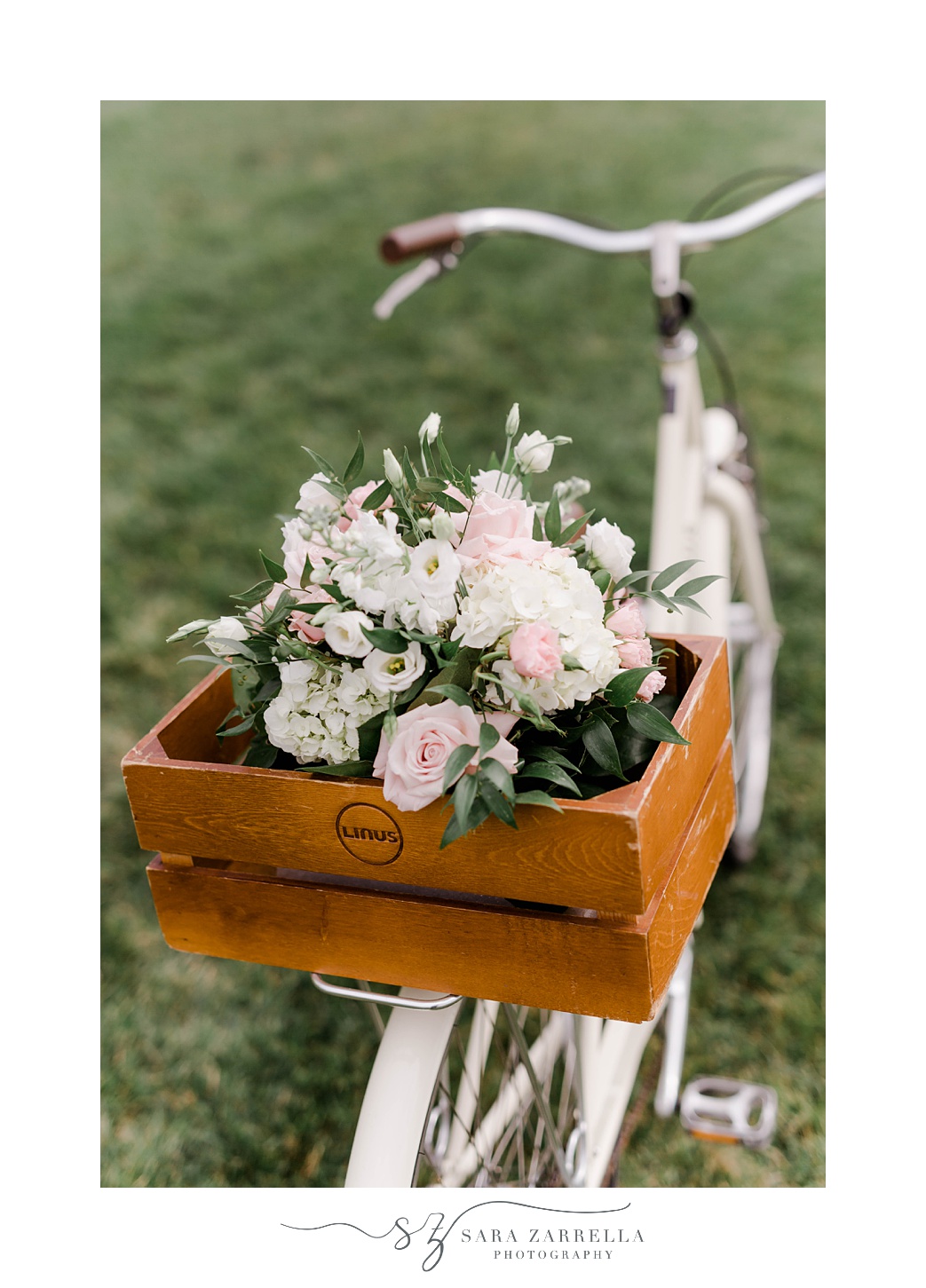 bike with pink and white flowers on back for ceremony decor at Gurney’s Newport
