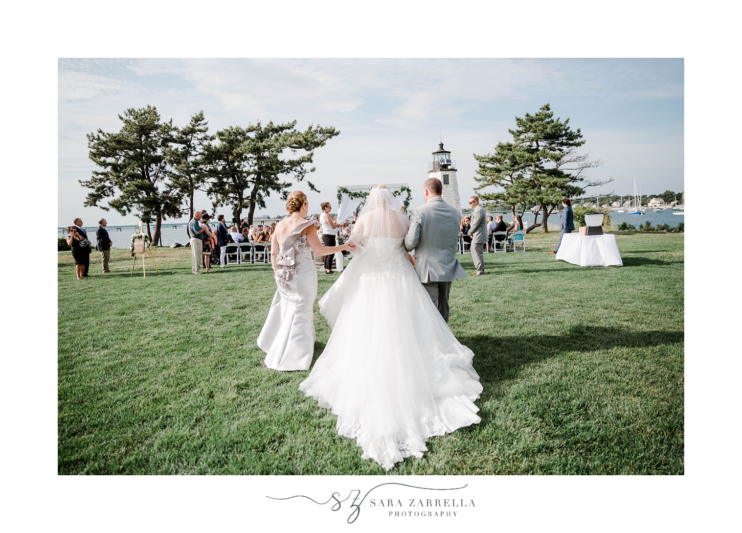 parents walk bride down aisle for ceremony at Gurney’s Newport
