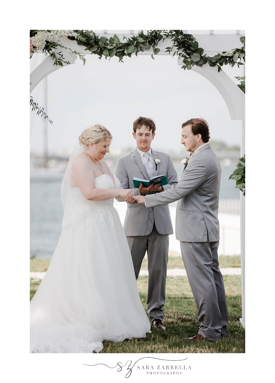 newlyweds exchange rings during ceremony in Rhode Island