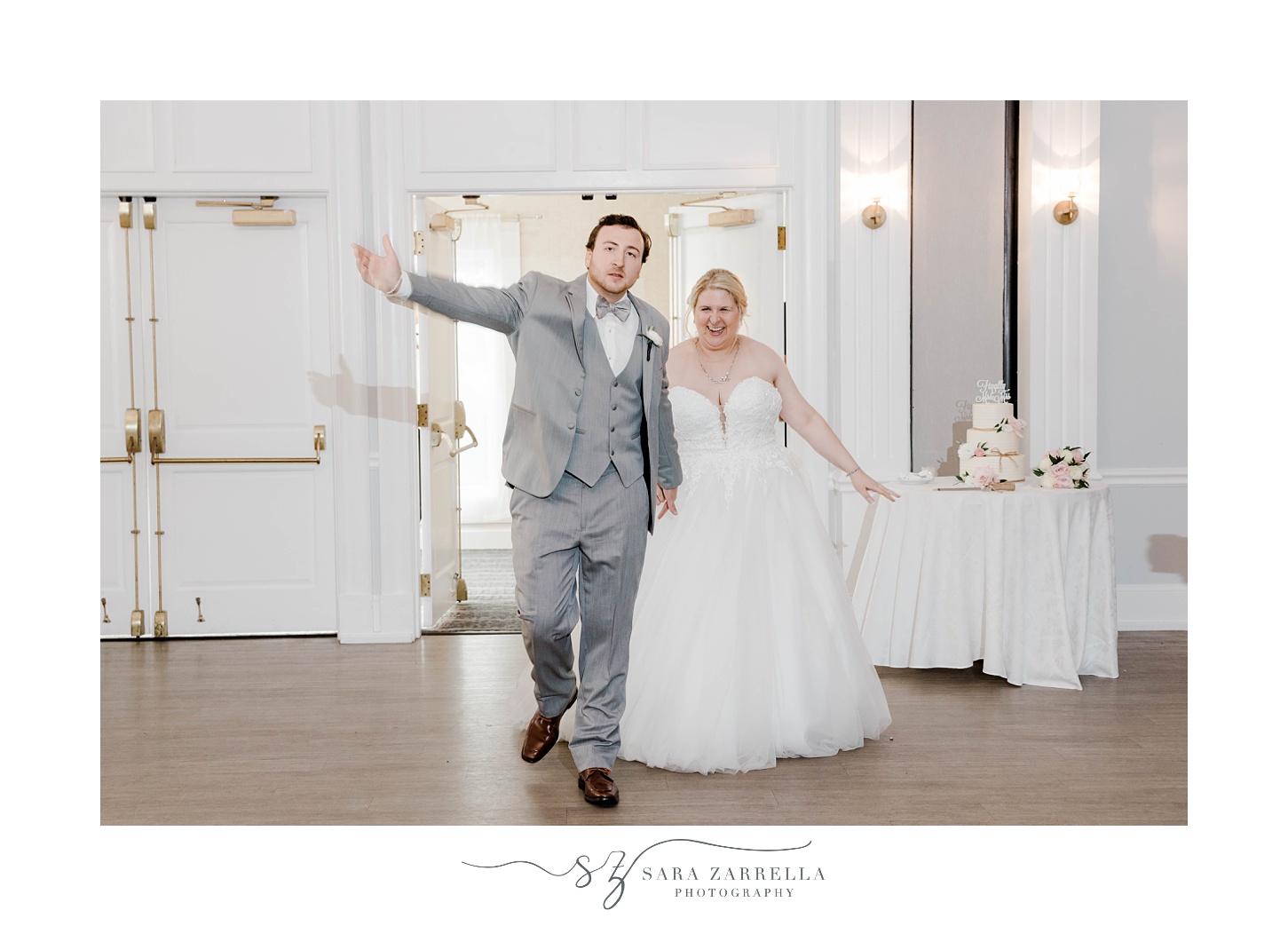 bride and groom wave walking into wedding reception in Newport RI