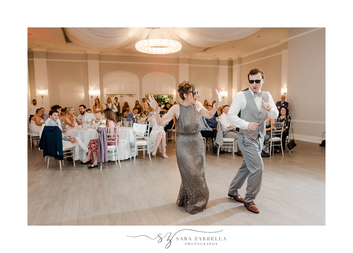 groom dances with mom during RI wedding reception in sunglasses 