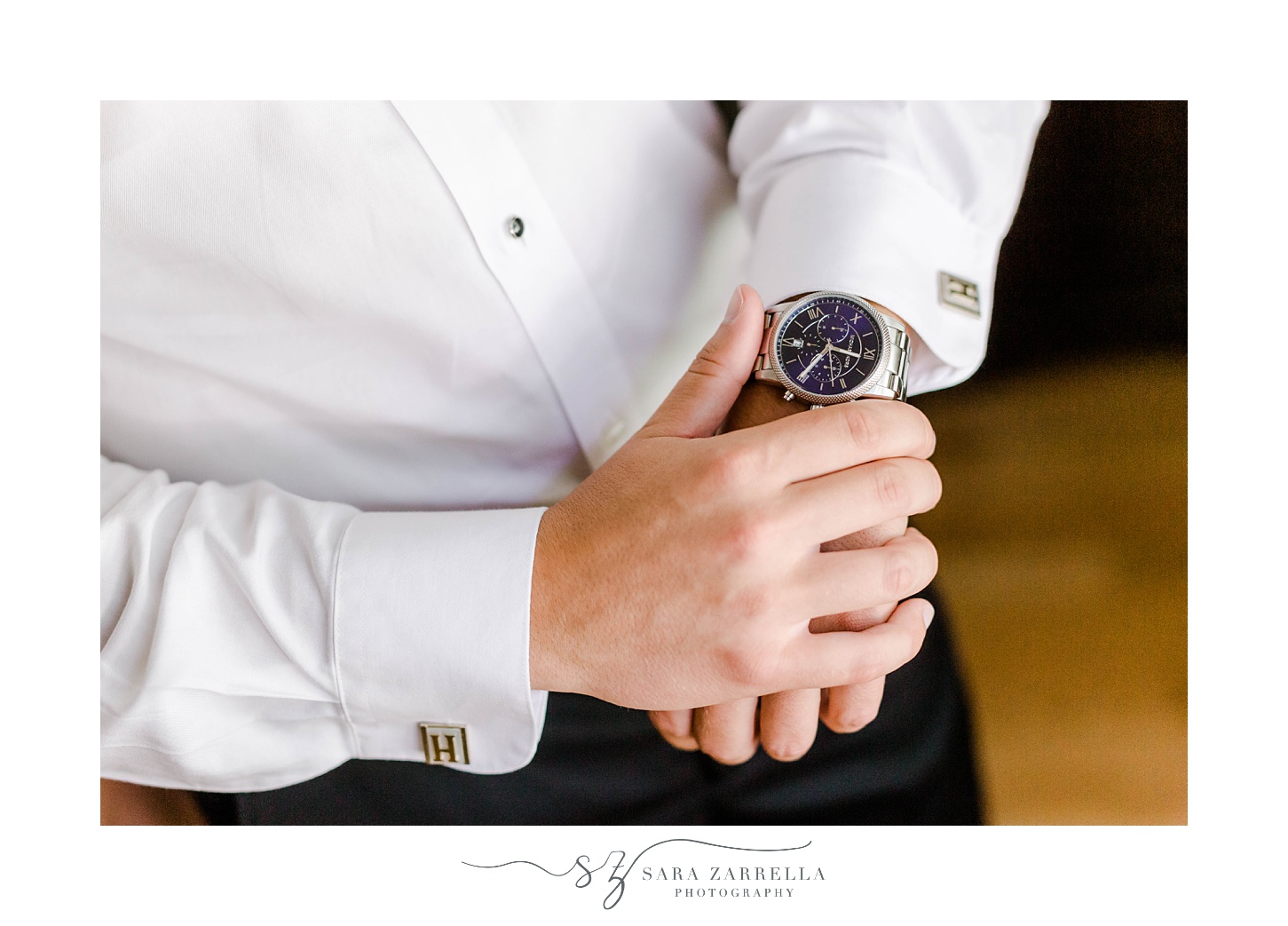 groom adjusts new watch before wedding day