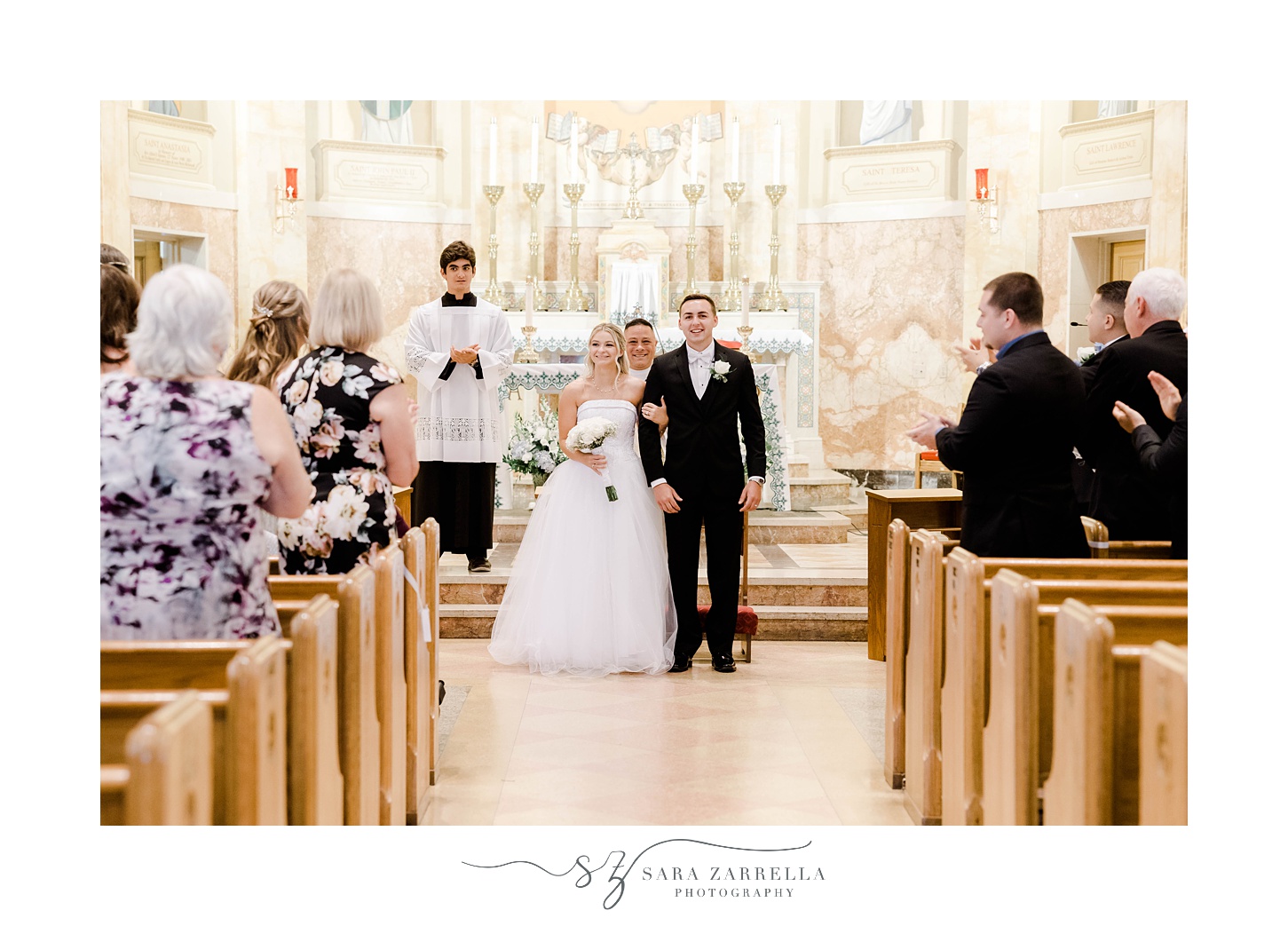 newlyweds leave Catholic church wedding ceremony in Rhode Island