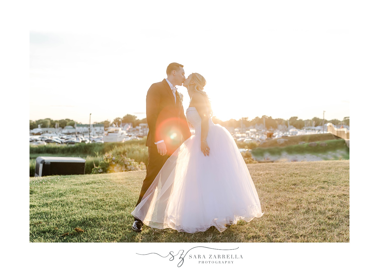 bride and groom kiss at sunset in Warwick RI