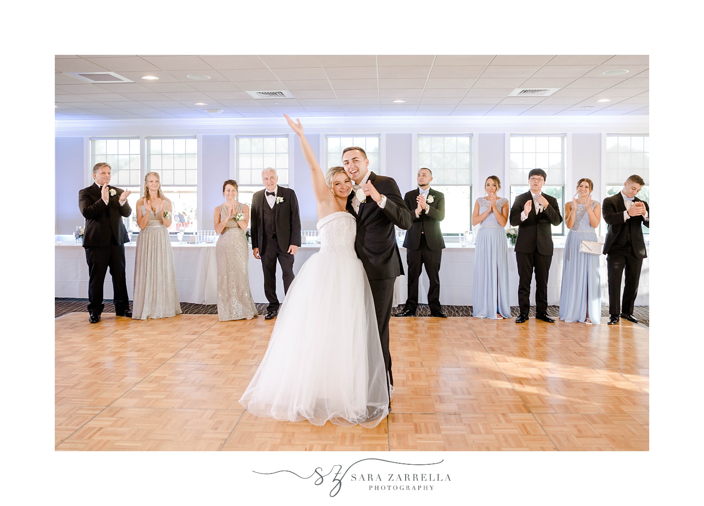 bride and groom pose on dance floor
