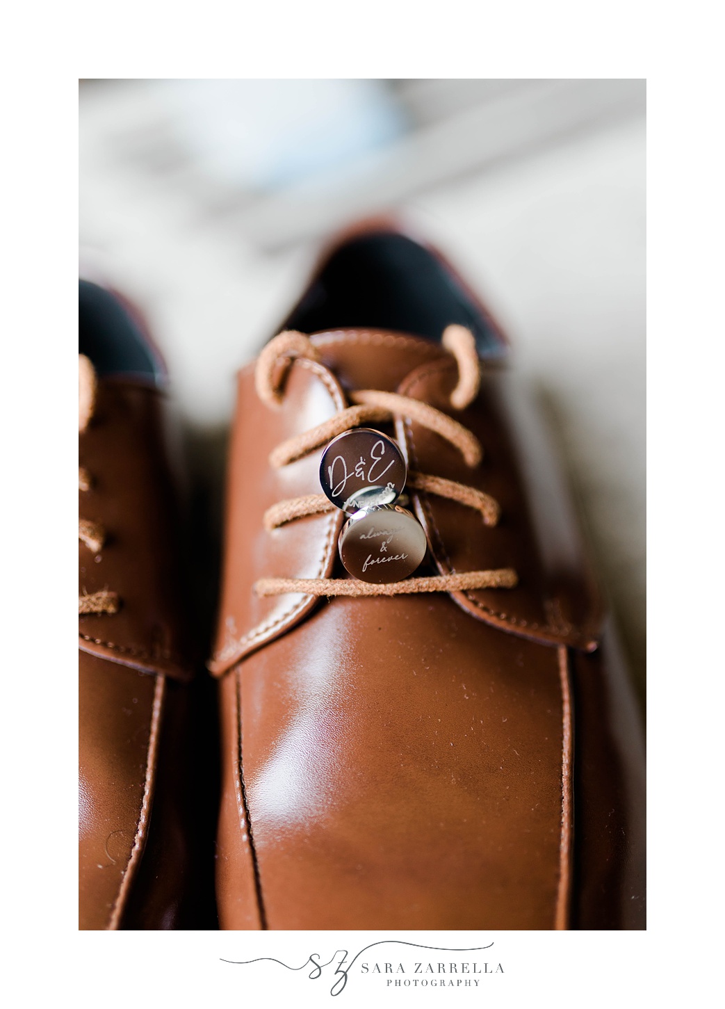 groom's brown shoes and ring