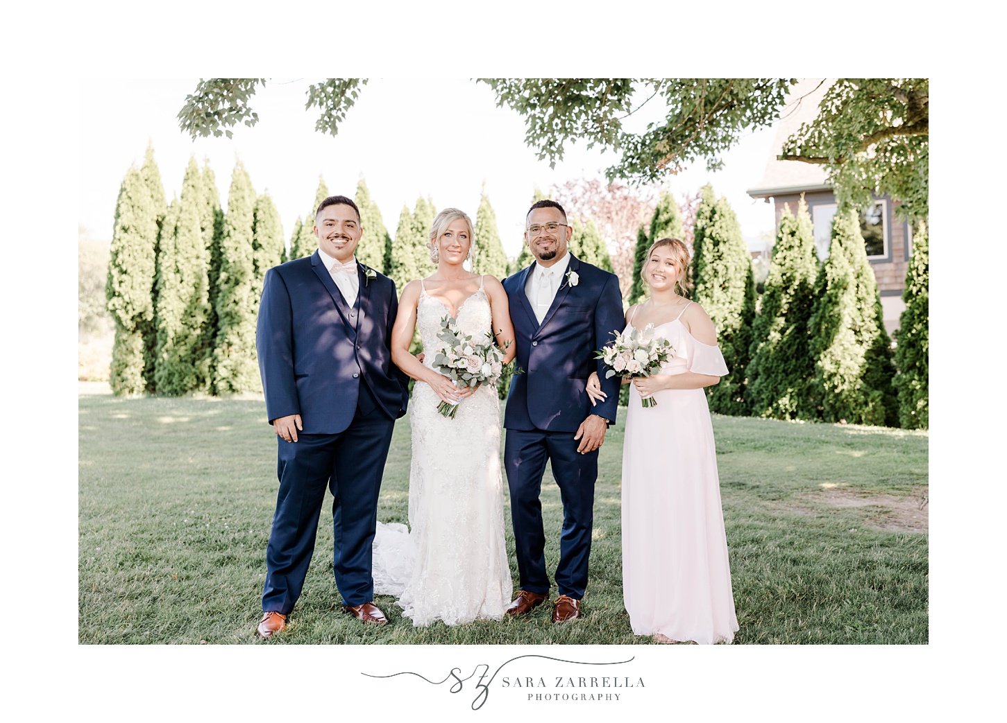 bride and groom stand with maid of honor and best man