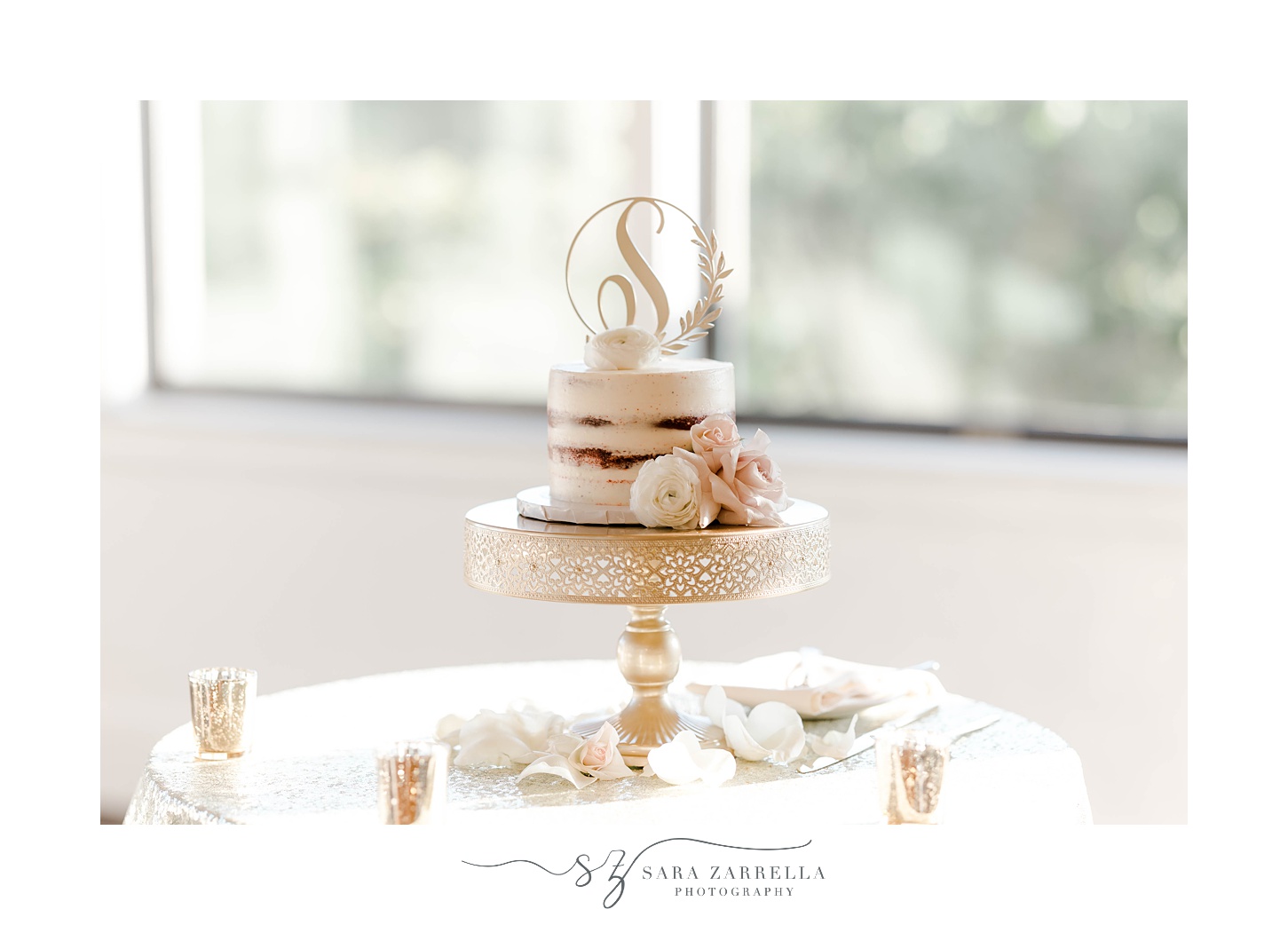 naked wedding cake with custom gold topper