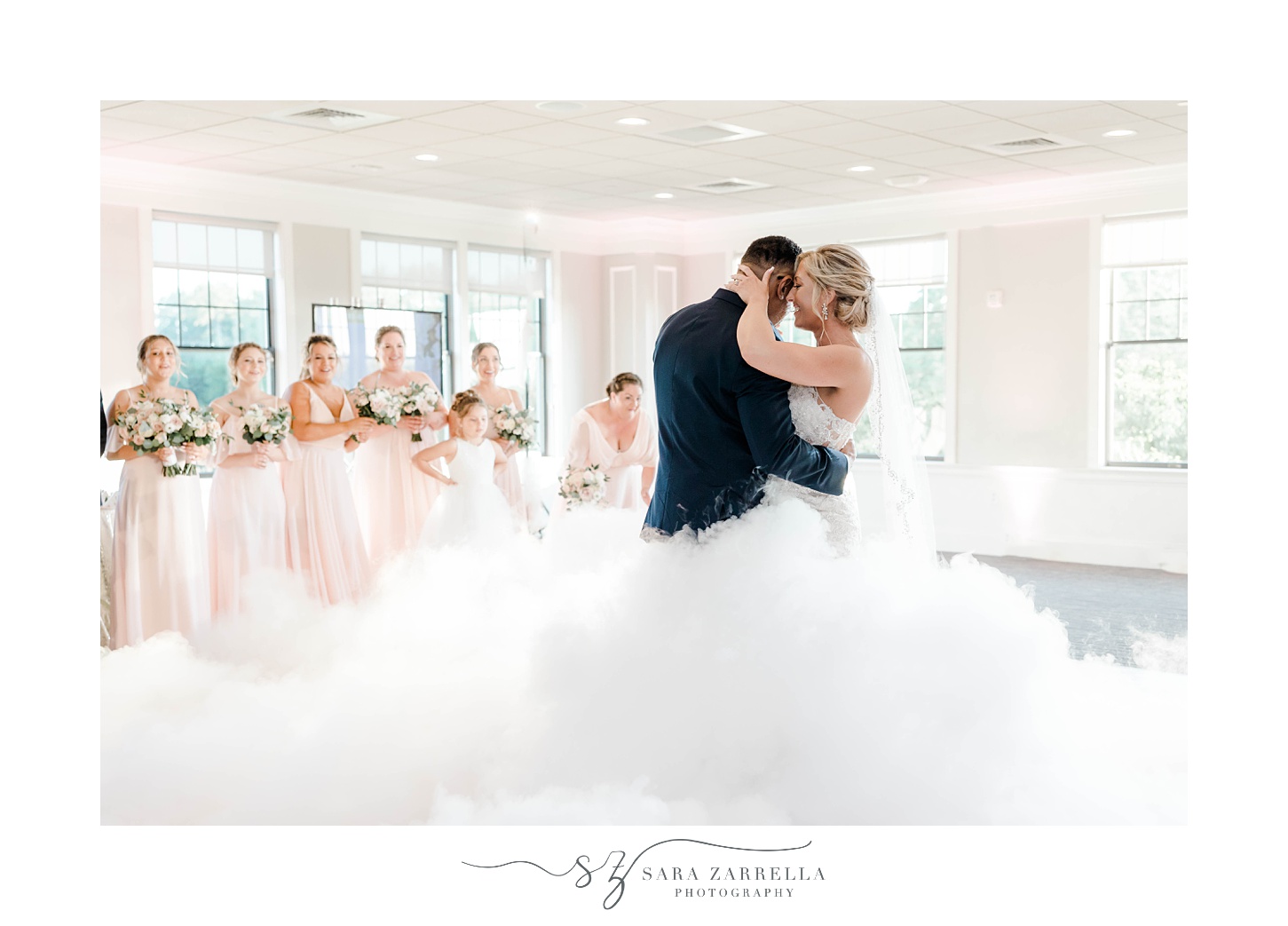 bride and groom dance during Warwick RI wedding reception with fog on dance floor