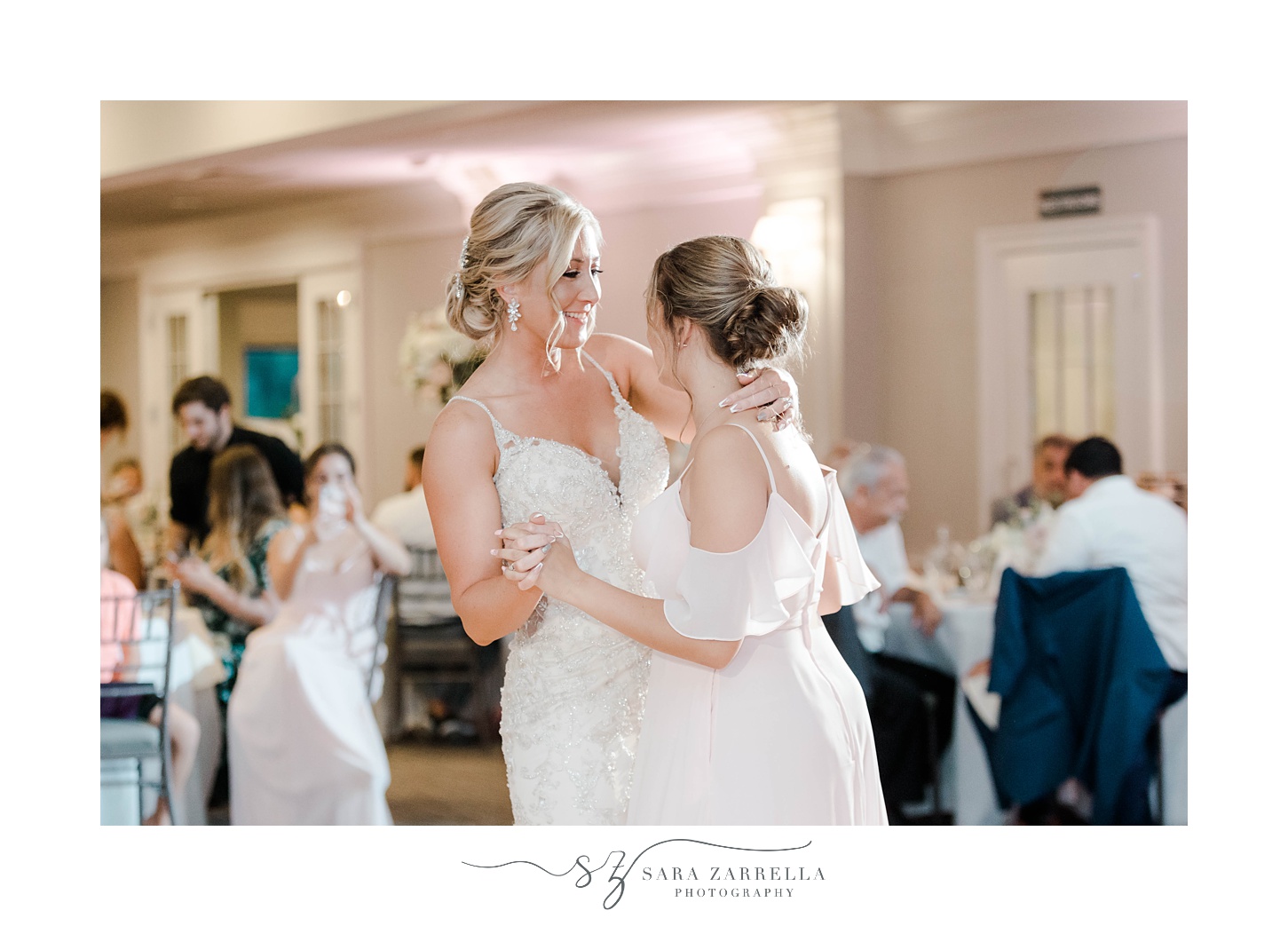bride dances with daughter during wedding day