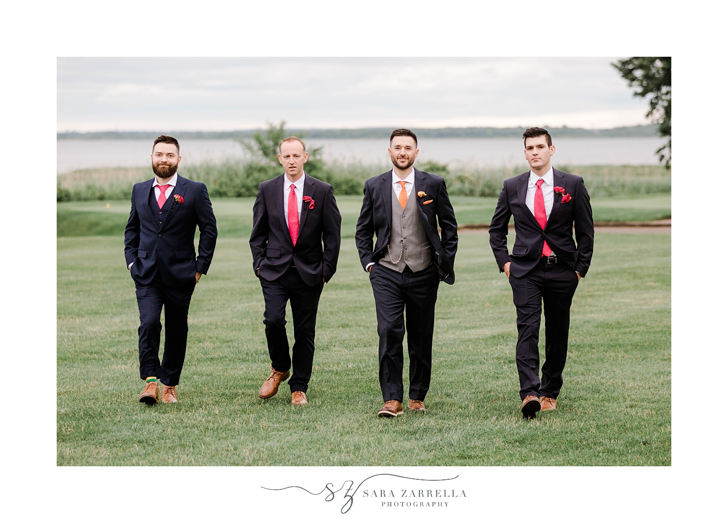 groom walks with groomsmen in Rhode Island 