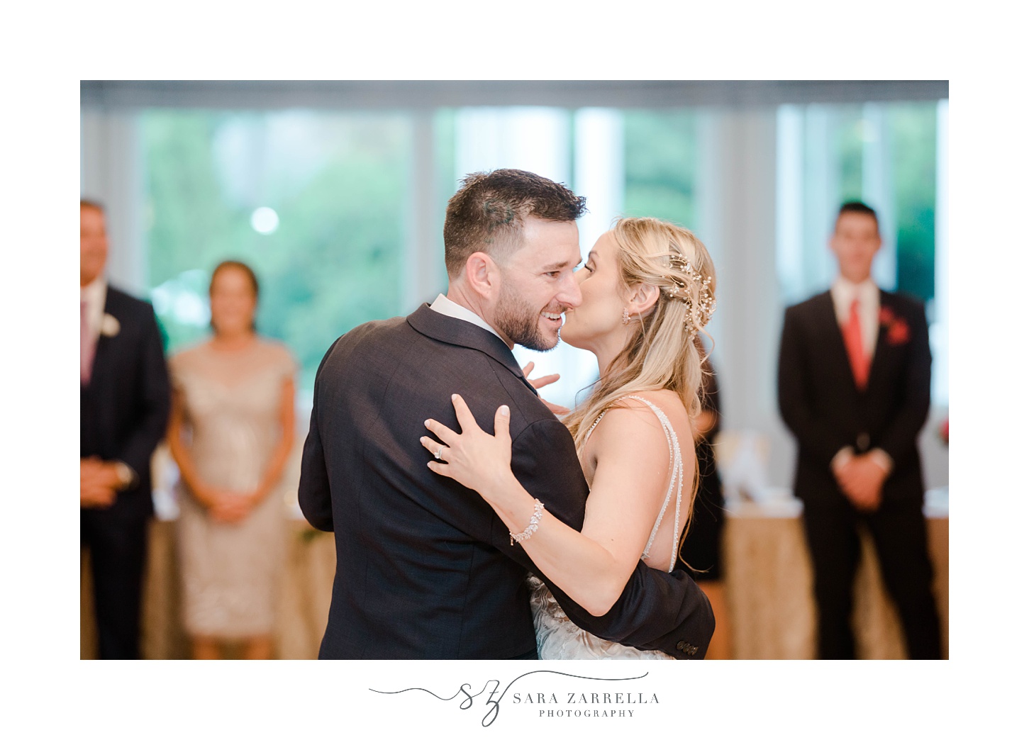 newlyweds dance together at Quidnessett Country Club