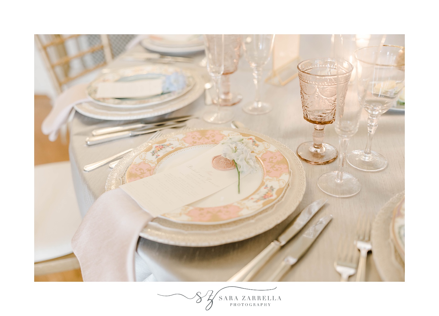 Rosecliff Mansion place settings with pink and gold details 