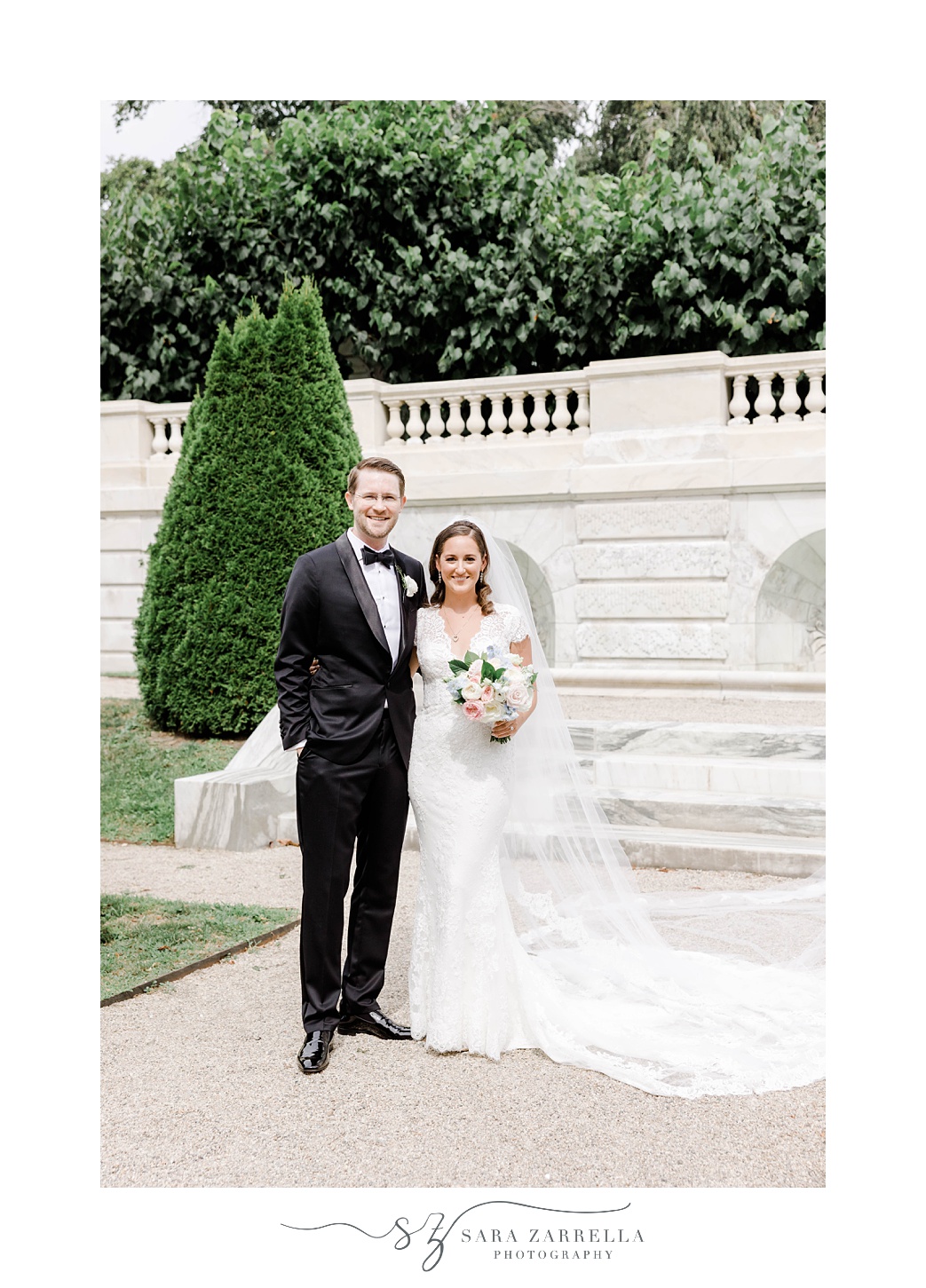 newlyweds stand together in gardens at The Elms