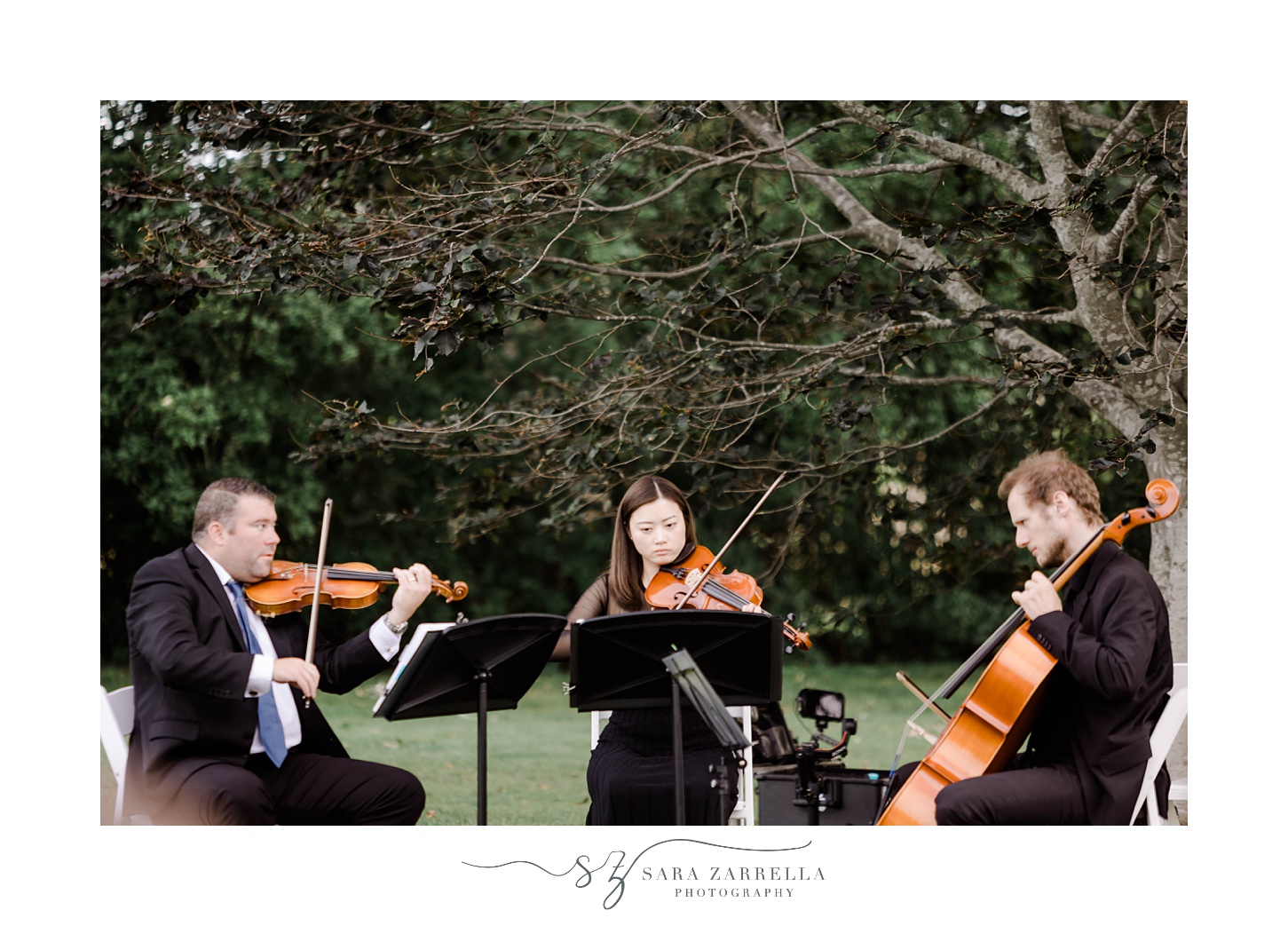 quartet plays music during waterfront ceremony at Rosecliff Mansion