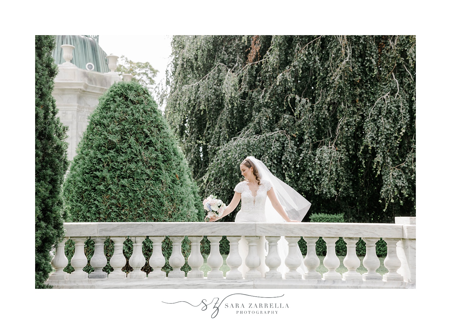bride leans on stone wall at The Elms