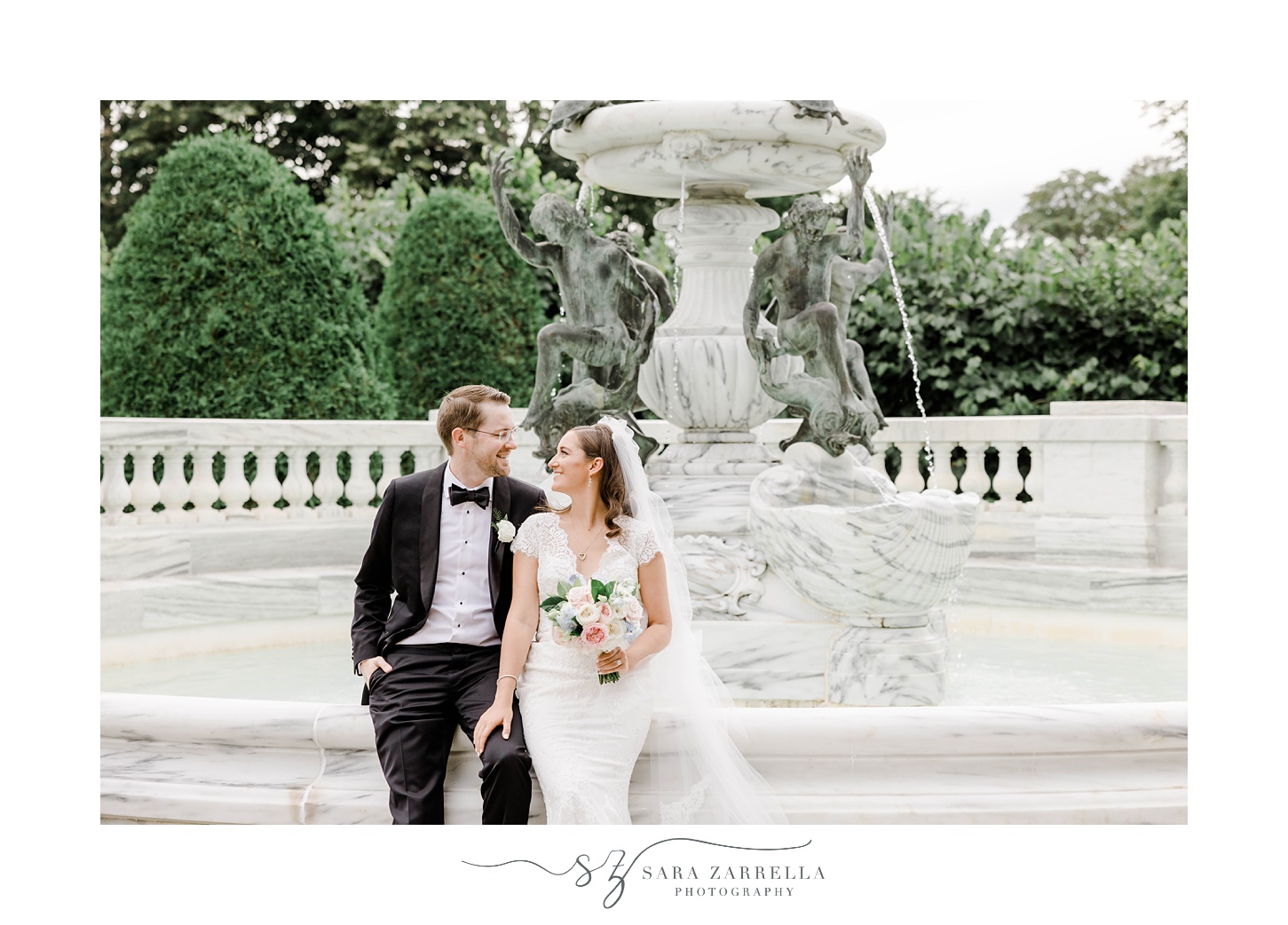 newlyweds sit on edge of fountain at The Elms