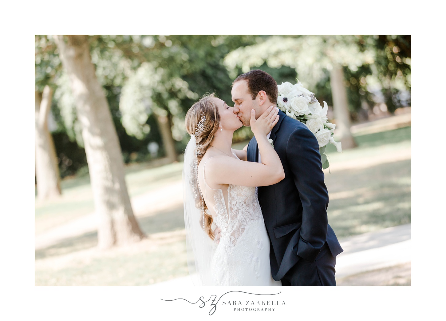 newlyweds kiss during portraits at The Bohlin