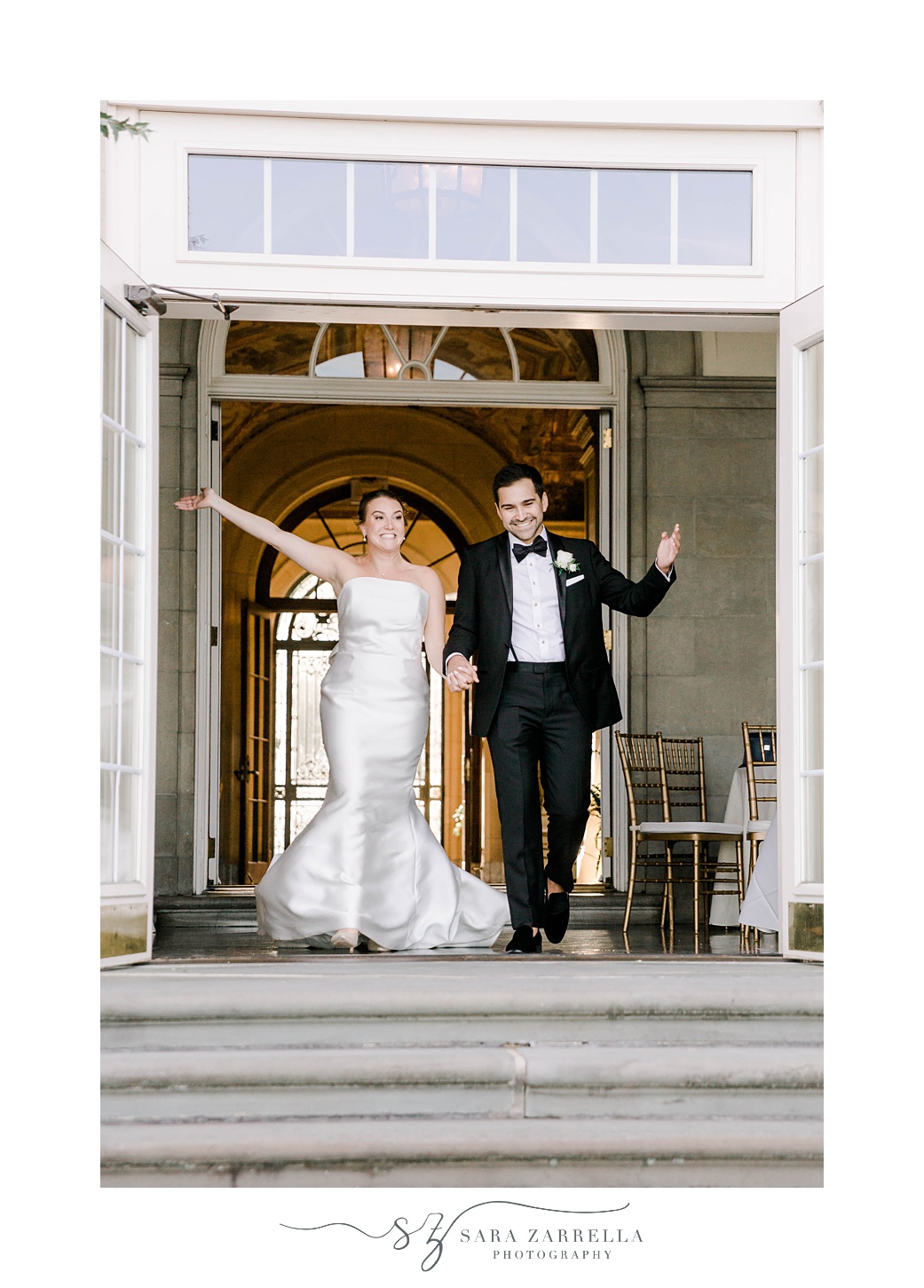 bride and groom wave to guests on patio at Aldrich Mansion