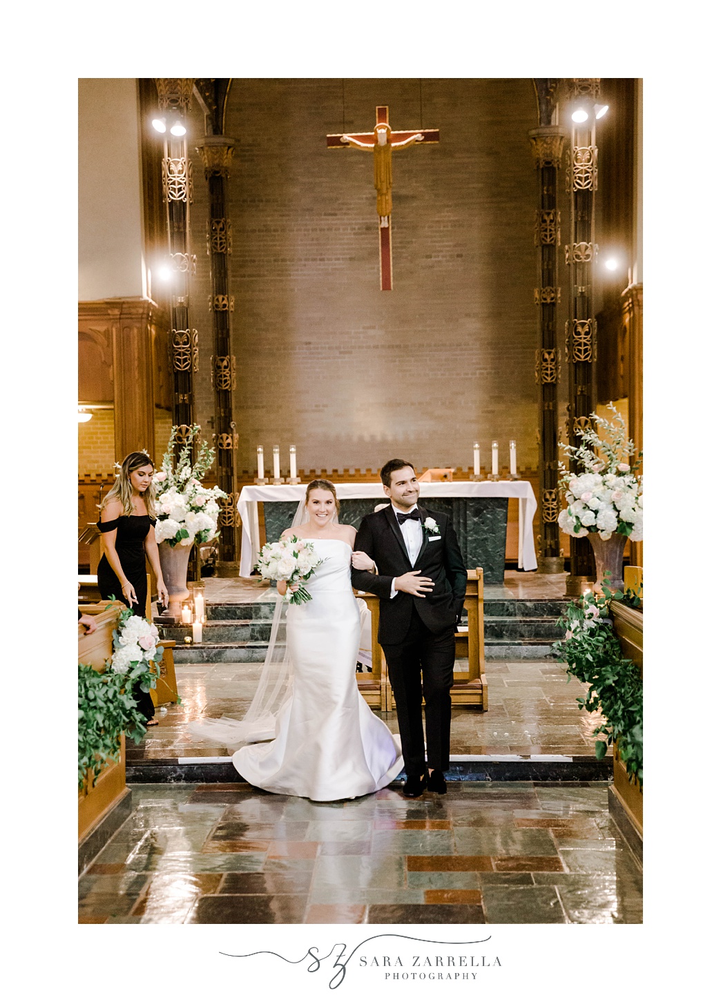 newlyweds recess up aisle at Aldrich Mansion chapel