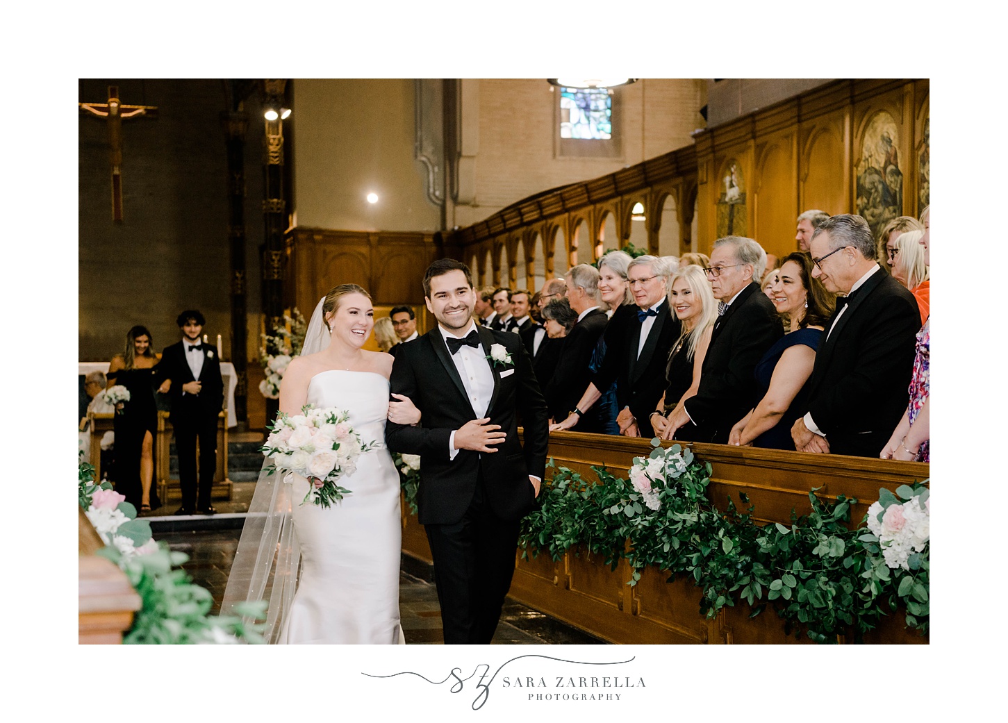 newlyweds recess up aisle at Aldrich Mansion chapel