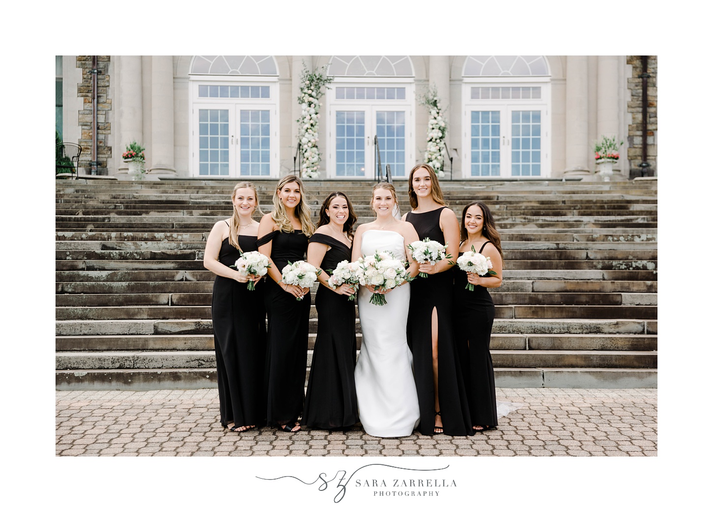 bride stands with bridesmaids in classic black gowns outside Aldrich Mansion