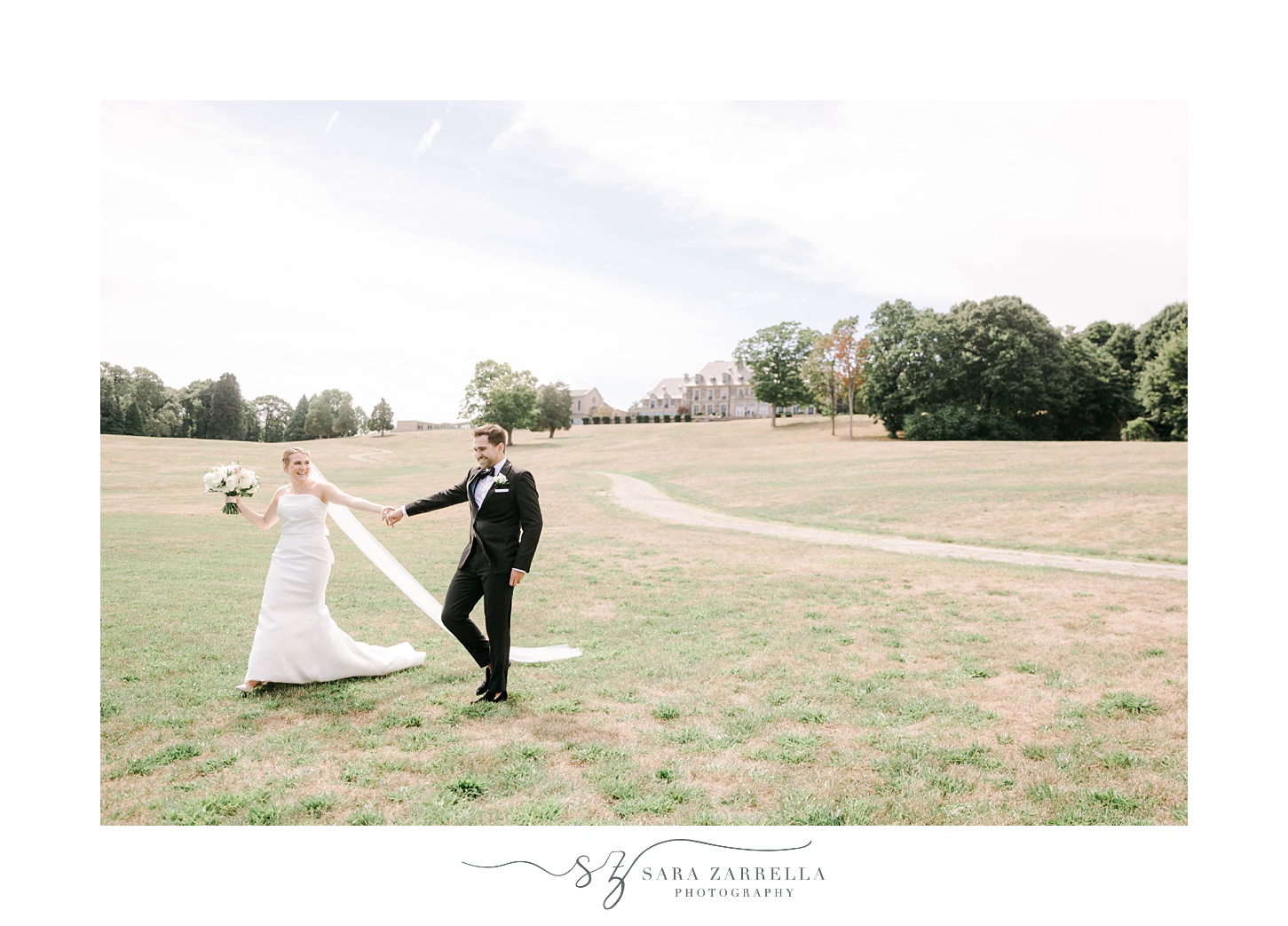 bride and groom walk on lawn at Aldrich Mansion