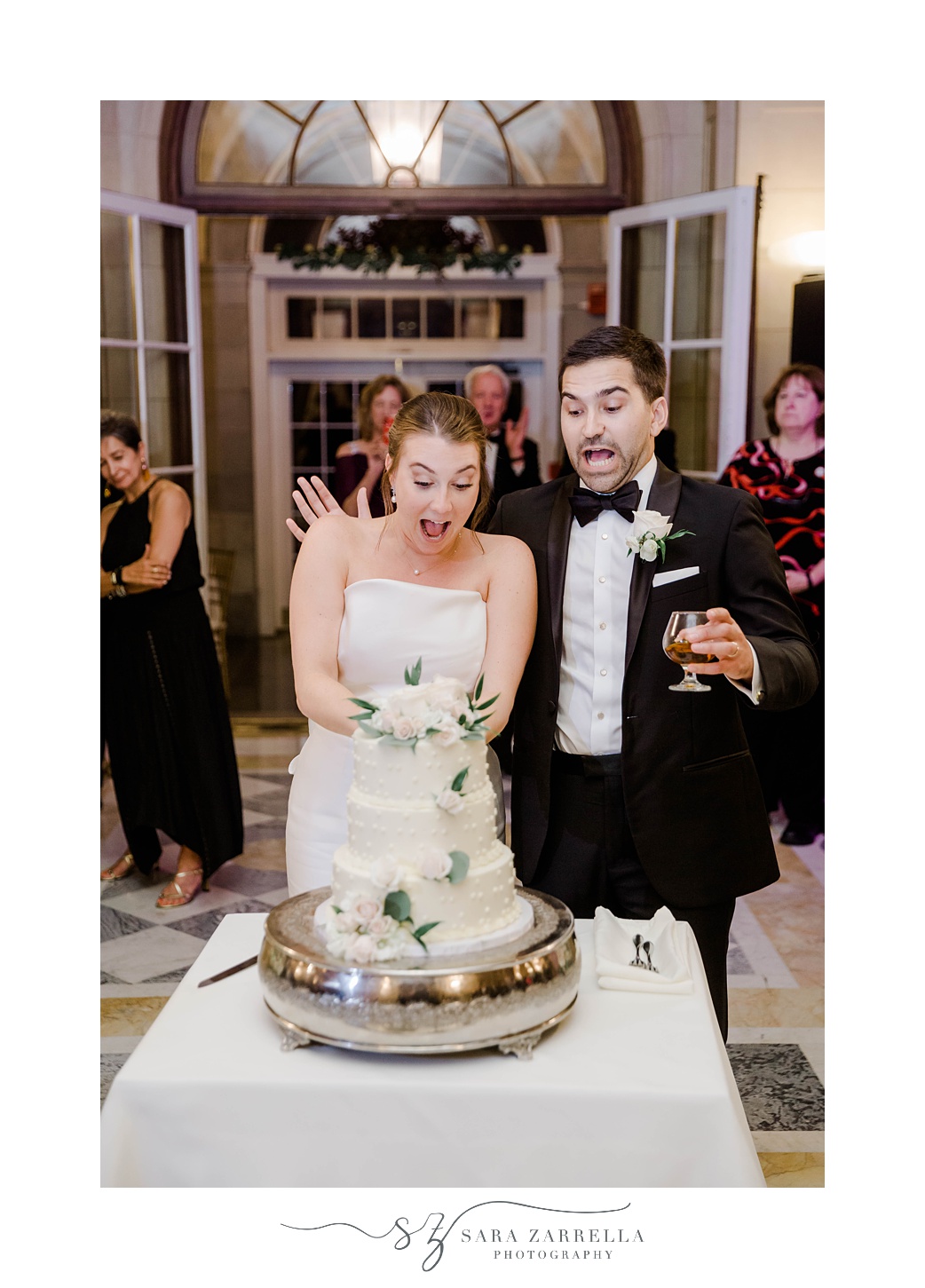 bride and groom react to wedding cake