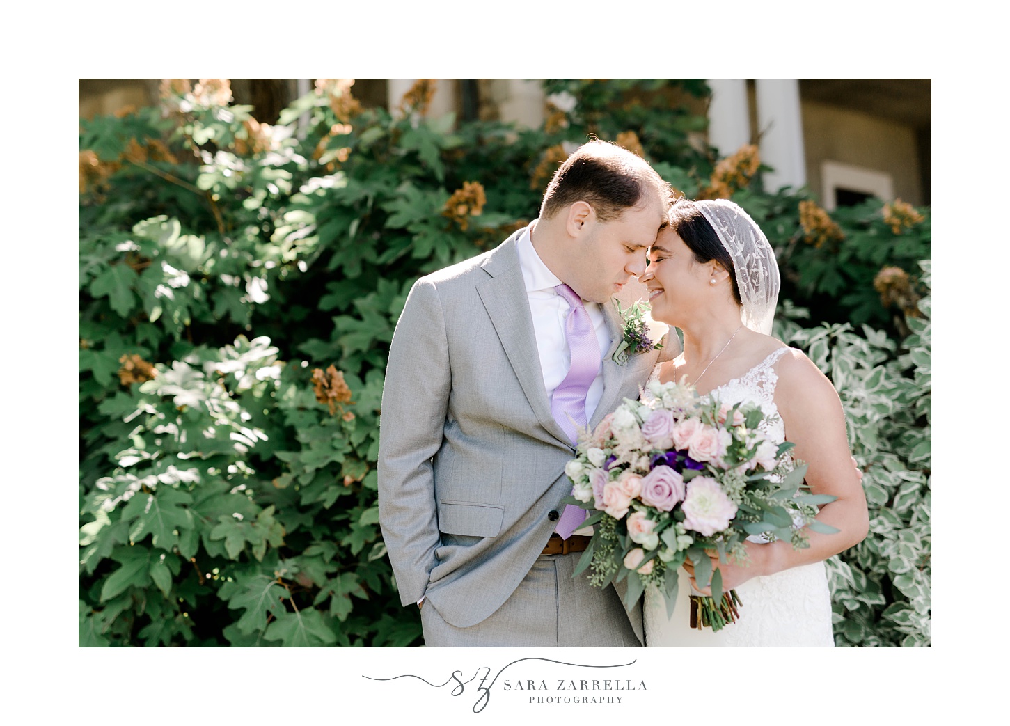 bride and groom lean in touching noses at Blithewold Mansion