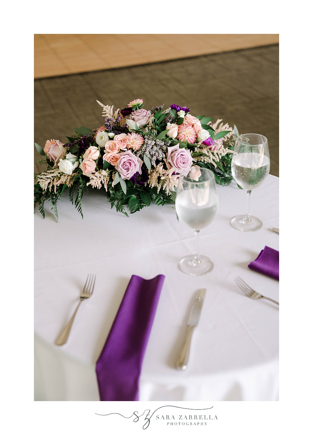 sweetheart table with pink and purple accents at Blithewold Mansion