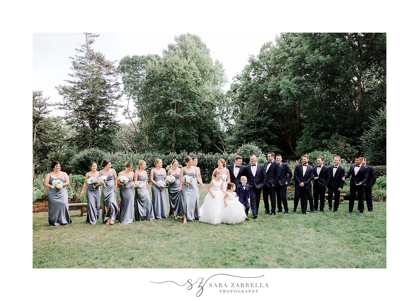 bride and groom walk with wedding party at Glen Manor House