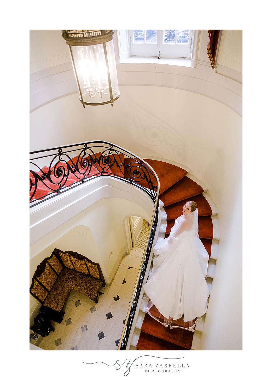bride walks up staircase inside Glen Manor House