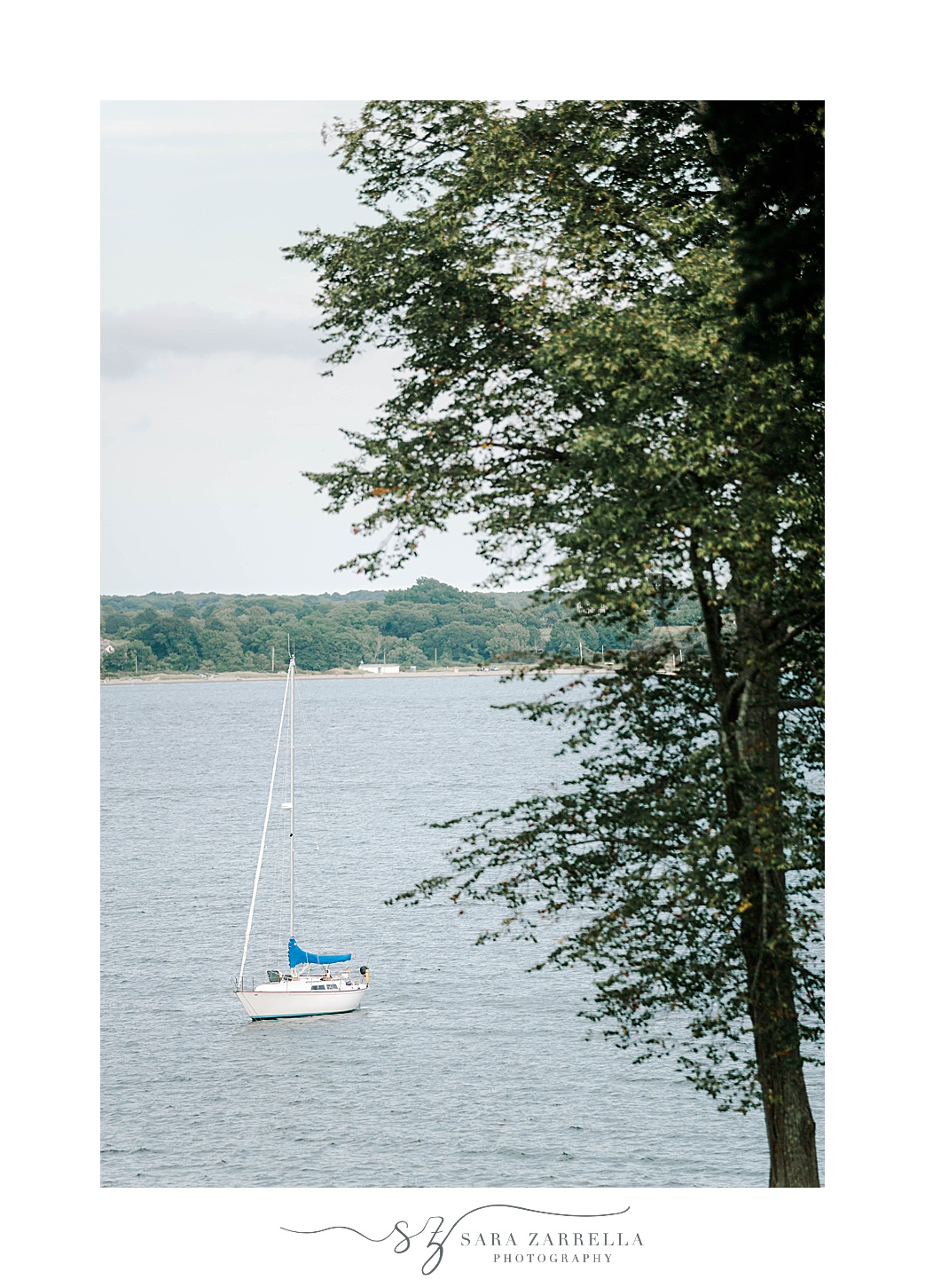 waterfront with sail boat at Glen Manor House