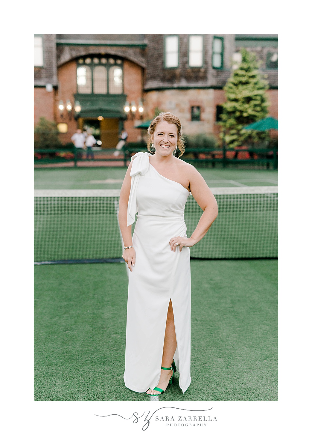 bride poses in one shoulder gown at The International Tennis Hall of Fame