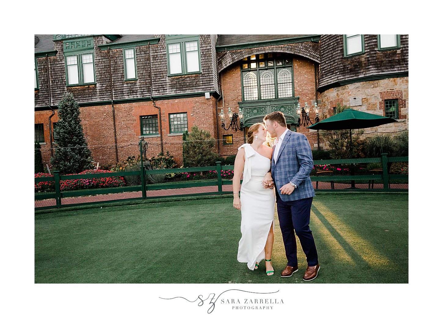 bride and groom kiss on lawn at The International Tennis Hall of Fame