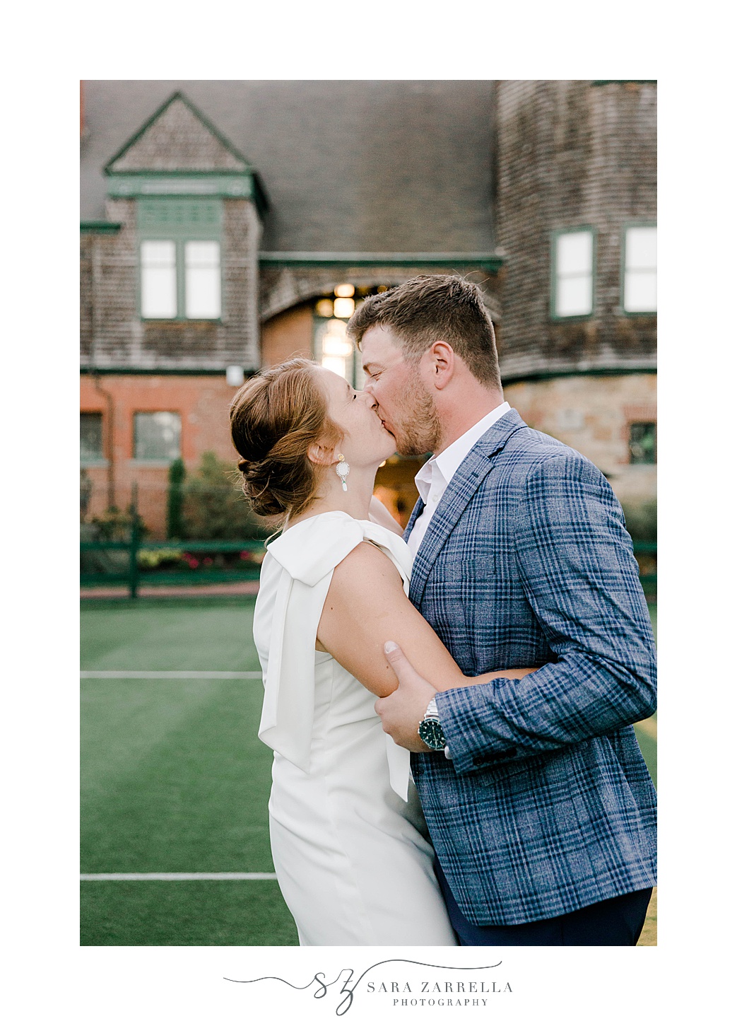 Rhode Island bride and groom kiss on lawn at The International Tennis Hall of Fame