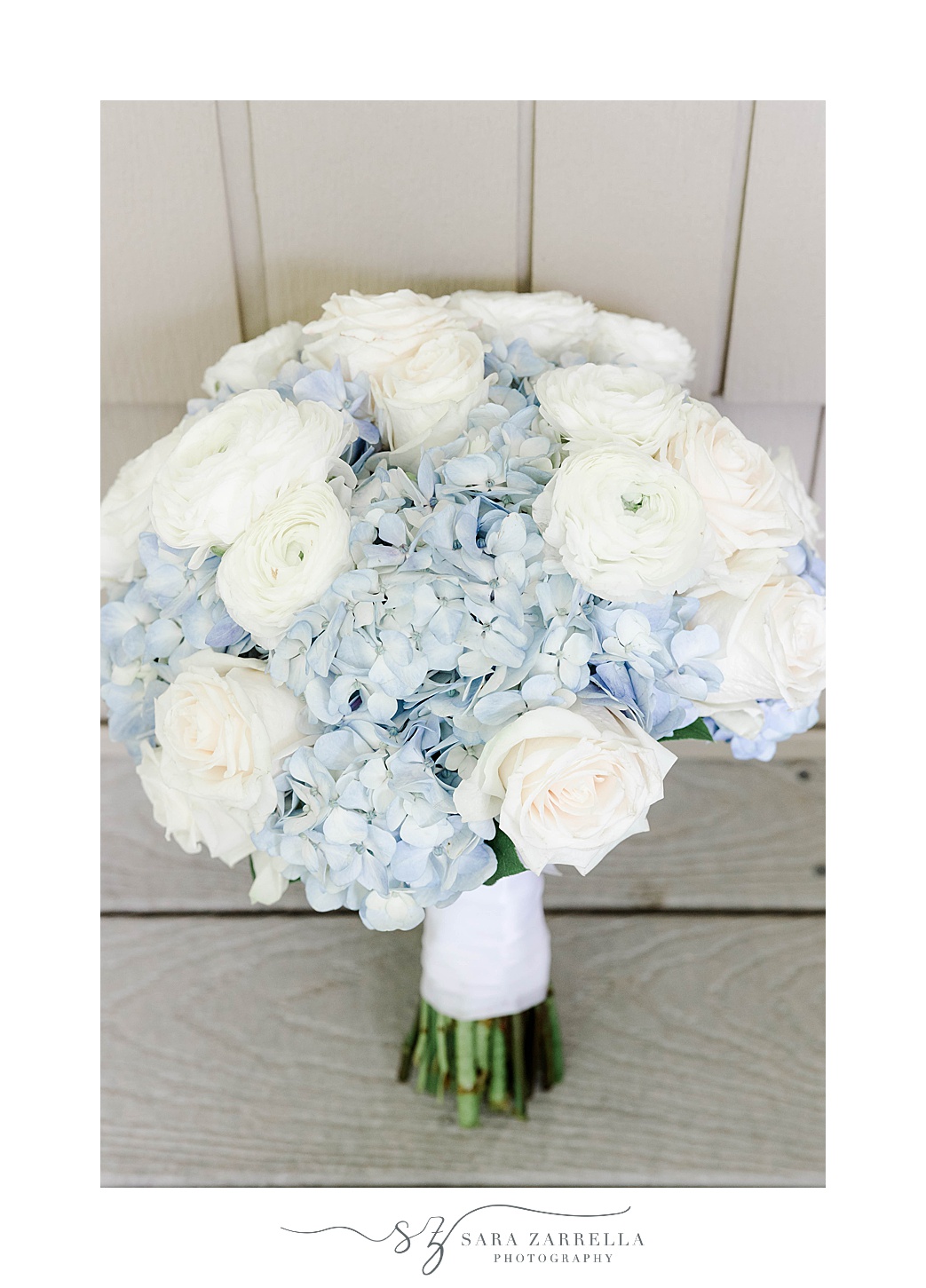 bride's bouquet with blue hydrangeas and white roses