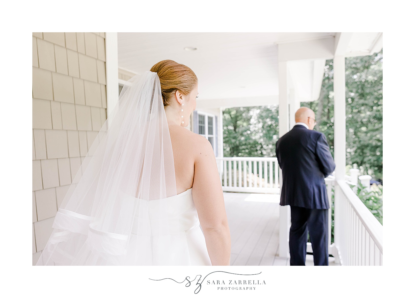 bride and dad have first look on porch